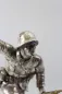 Preview: Plastische Darstellung eines mit Handgranate Voranstürmenden Infanteristen. Spritzguss versilbert, Gesamthöhe 23,5cm