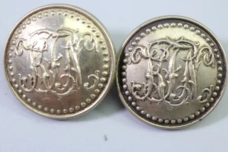 Metal uniform button from the stock of an old uniform tailor,