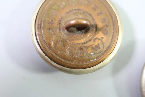 Metal uniform button from the stock of an old uniform tailor,