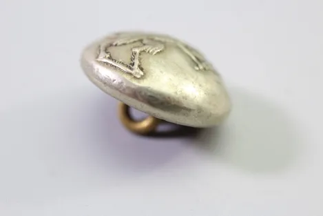 Original metal uniform button, also known as a livery button