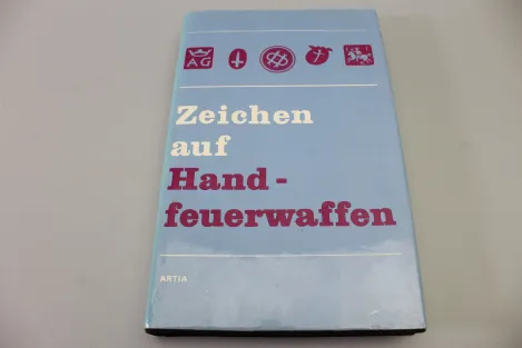 Zeichen auf Handfeuerwaffen.