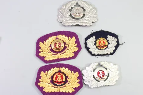 Collection of cap wreaths, including a general's cap wreath, 5 pieces in total.