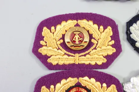 Collection of cap wreaths, including a general's cap wreath, 5 pieces in total.