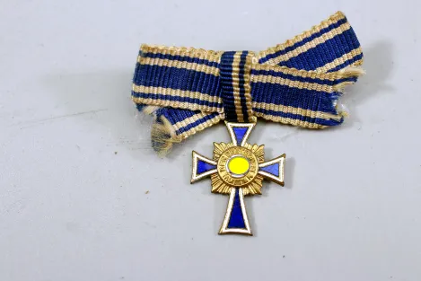 Miniature German Mother's Cross in Gold On ribbon bow; enamel undamaged.