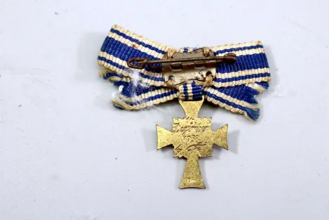 Miniature German Mother's Cross in Gold On ribbon bow; enamel undamaged.