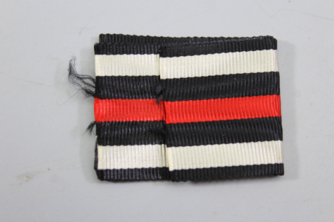 Kriegsverdienstkreuz 2. Klasse mit Schwertern mit Tüte 1939 mit Packpapier für das Band