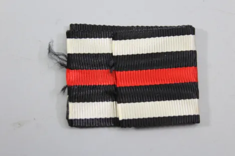Kriegsverdienstkreuz 2. Klasse mit Schwertern mit Tüte 1939 mit Packpapier für das Band
