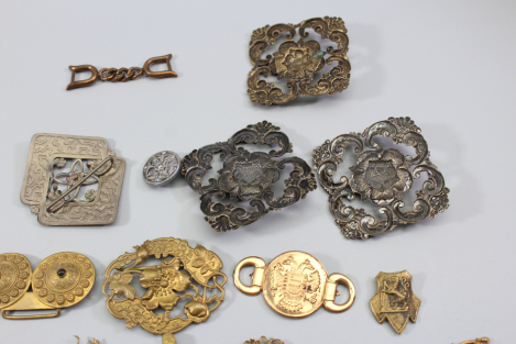 Collection of buckles and miscellaneous items from an old uniform tailoring workshop