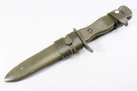 Original Bundeswehr combat knife (older OFW 73 pattern) with belt frog; genuine item.