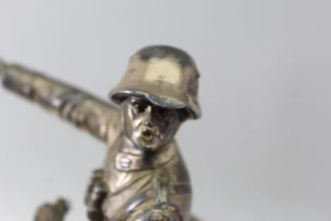 Original sculpture of a mounted German Wehrmacht cavalry soldier with steel helmet and equipment; inscribed "In memory of my service 1924–1938"