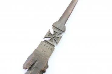 Patriotic letter opener made of shrapnel, blade tip damage