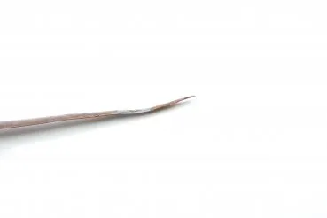 Patriotic letter opener made of shrapnel, blade tip damage