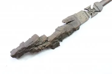 Patriotic letter opener made of shrapnel, blade tip damage