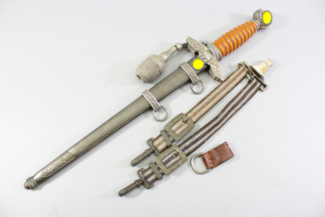 Excellent Luftwaffe officer’s dagger with an orange grip, made by SMF, Solingen. Includes acceptance stamp and hangers.