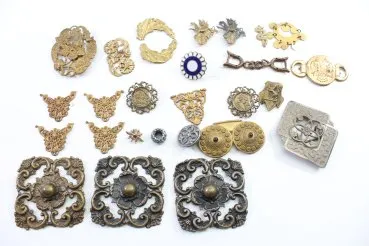 Discover a unique collection of 27 original uniform parts, buttons, badges, overlays, and buckles