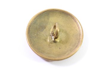 Metal buttons from a German uniform tailor, head uniform
