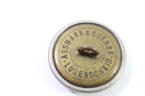 Metal buttons from a German uniform tailor, head uniform