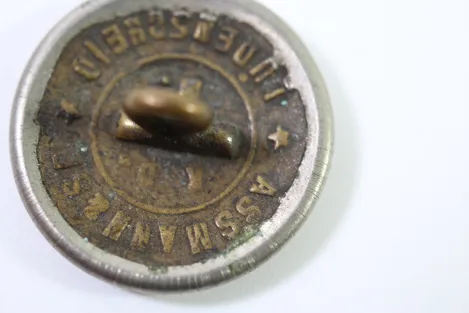 Metal buttons from a German uniform tailor, head uniform