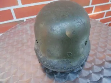 Wehrmacht steel helmet M 35 with two emblems and remains of camouflage