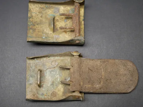 2x belt buckles, found in the ground - SA denazified + Prussia with leather tongue