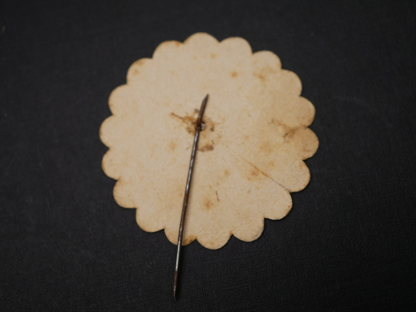 Paper badge – flower with swastika – Labor Day