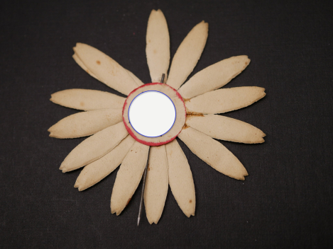 Paper badge – flower with swastika – Labor Day