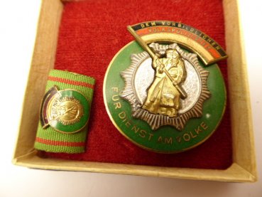 Medal "Badge of Honor of the German People's Police" with an interim clip in a case