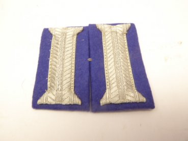 A pair of sleeve flaps, weapon color blue, from a tailor's estate