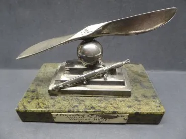 Farewell present - propeller with on-board dagger on base