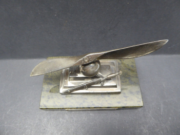 Farewell present - propeller with on-board dagger on base