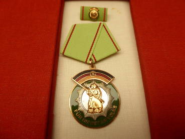 Medal - badge of honor of the German People's Police - in a decorative folder