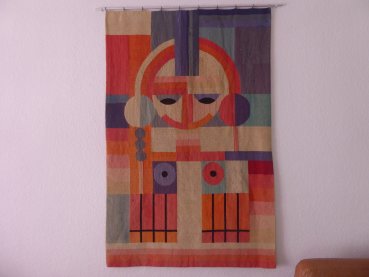 Bauhaus wall hanging / tapestry - geometrically arranged female body. (face + braids + breasts). Environment Grete Reichard