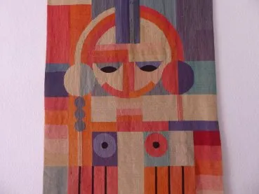 Bauhaus wall hanging / tapestry - geometrically arranged female body. (face + braids + breasts). Environment Grete Reichard