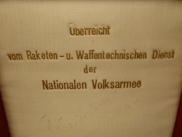 Plaque in a case "Handed over by the Rocket and Weapons Technical Service of the National People's Army"