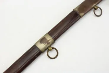 Officer's saber with blade etching in leather sheath.