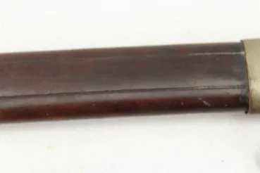 Officer's saber with blade etching in leather sheath.