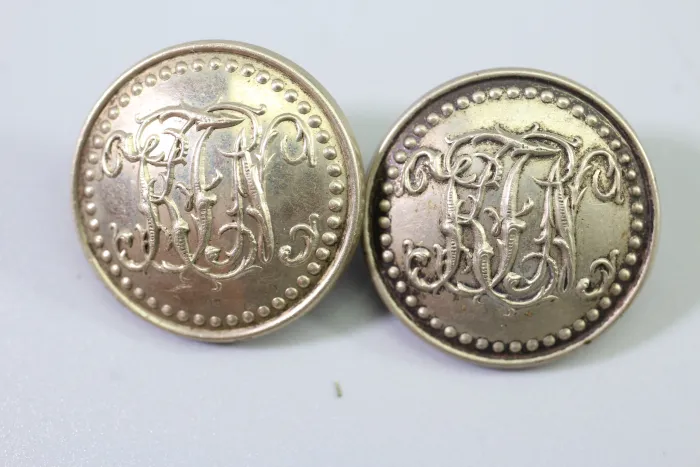 Metal uniform button from the stock of an old uniform tailor,