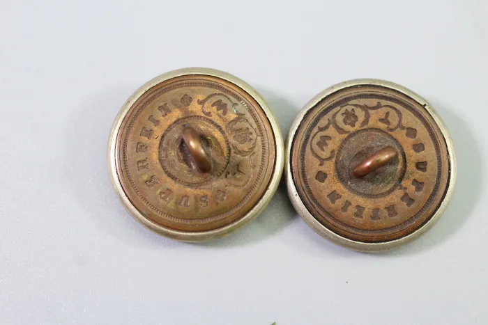 Metal uniform button from the stock of an old uniform tailor,