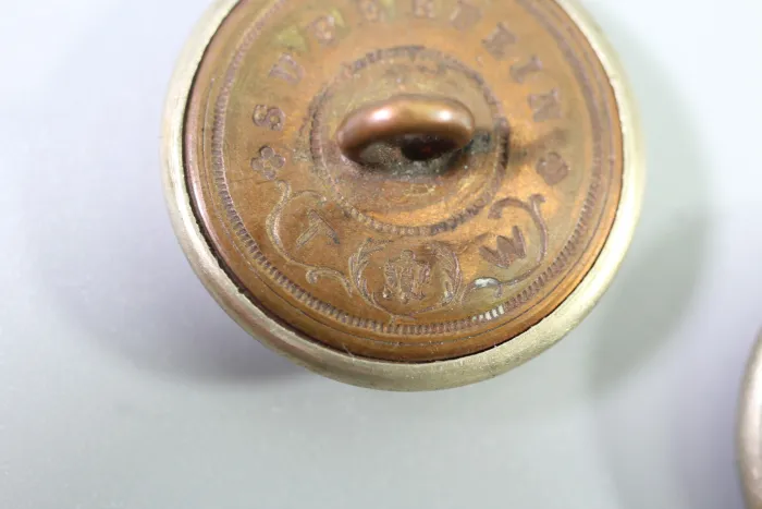 Metal uniform button from the stock of an old uniform tailor,