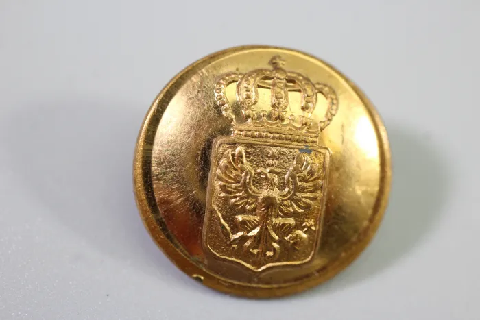 Original metal uniform button, also known as a livery button