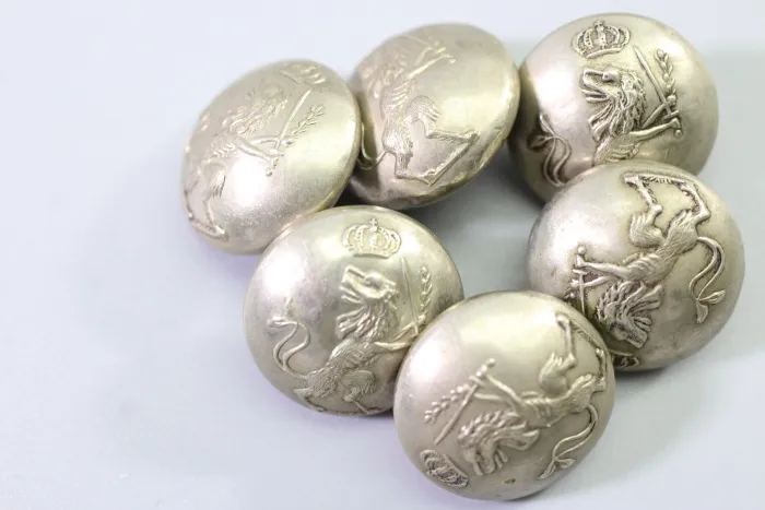 Original metal uniform button, also known as a livery button