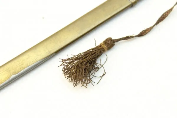 Letter opener in the shape of a miniature lion's head saber for officers with portepee