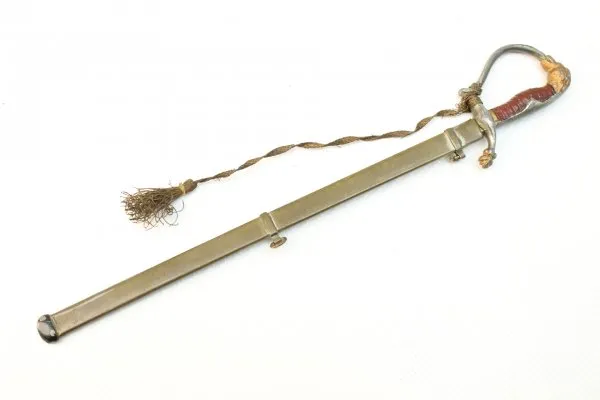 Letter opener in the shape of a miniature lion's head saber for officers with portepee