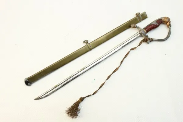 Letter opener in the shape of a miniature lion's head saber for officers with portepee