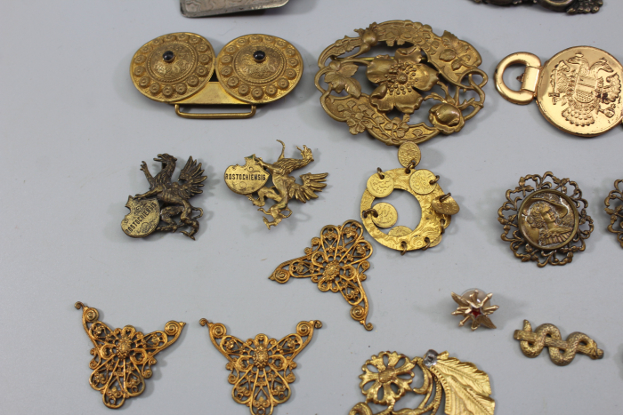 Collection of buckles and miscellaneous items from an old uniform tailoring workshop