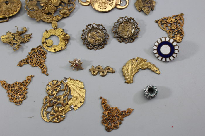 Collection of buckles and miscellaneous items from an old uniform tailoring workshop