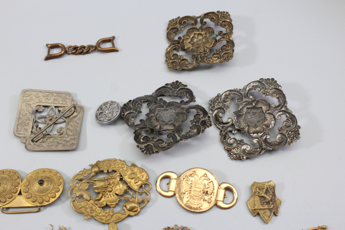 Collection of buckles and miscellaneous items from an old uniform tailoring workshop
