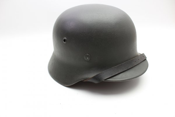 Wehrmacht M 40 EF 66/21478 steel helmet with wearer's name and a badge in top condition