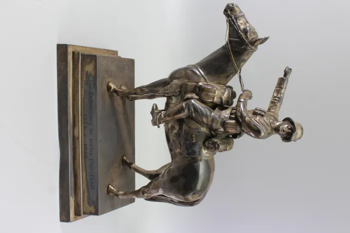 Original sculpture of a mounted German Wehrmacht cavalry soldier with steel helmet and equipment; inscribed "In memory of my service 1924–1938"