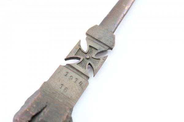 Patriotic letter opener made of shrapnel, blade tip damage